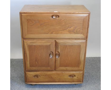 An Ercol light elm bureau