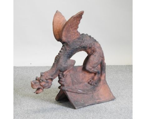A terracotta ridge tile, in the form of a gargoyle, 66cm high
