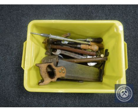 A box containing vintage hand tools