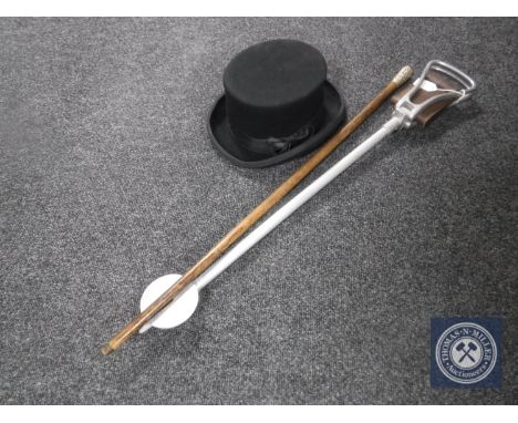 A shooting stick together with a silver handled walking cane and a gent's hat