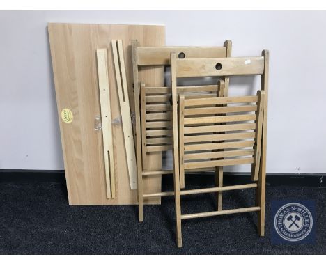 Three folding kitchen chairs, two 3' pine headboards, three boxed standard drawers and an Ikea metal revolving shelf 