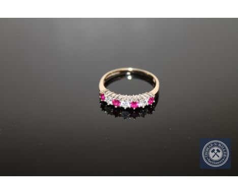 A 9ct gold ruby and diamond ring, size O