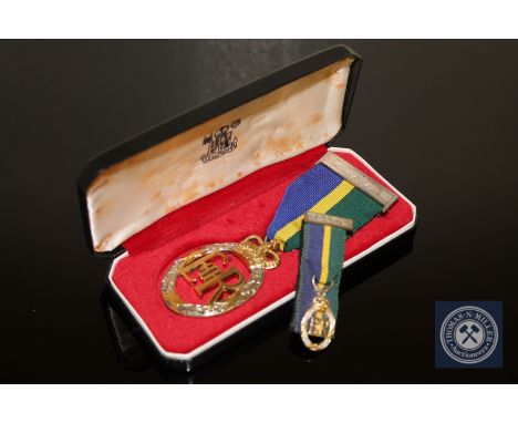 An Elizabeth II Territorial &amp; Army Volunteer Reserve decoration in silver with miniature, cased