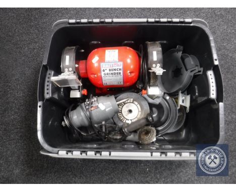 A plastic crate containing 6" bench grinder with accessories