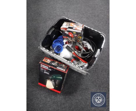 A plastic crate containing compressor tools and accessories