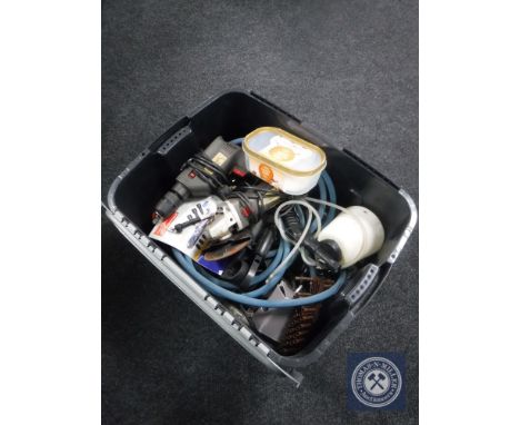 A plastic crate containing power tools, spray guns etc