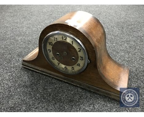 An oak cased mantel clock with key