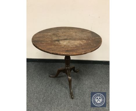 A George III oak tripod table, width 64 cm