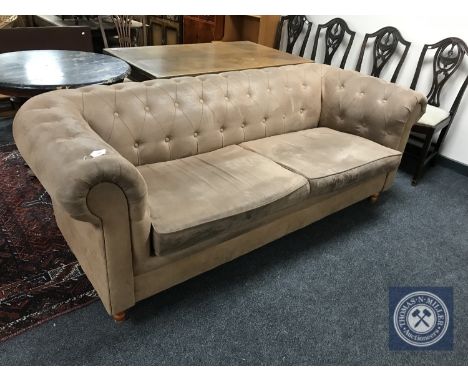 A button back Chesterfield style sofa in brown fabric 