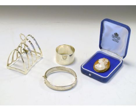 Elizabeth II silver four division toast rack, Birmingham 1972, George V silver napkin ring, Birmingham 1918 and an engraved s