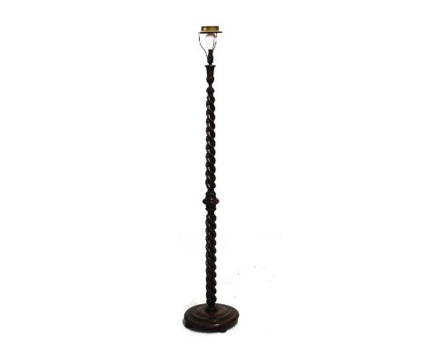 Early 20th Century oak standard lamp with barley twist stem on turned circular base   Condition: 