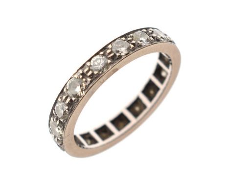 Unmarked white metal diamond set eternity ring, size M, 3.9g gross   Condition: 