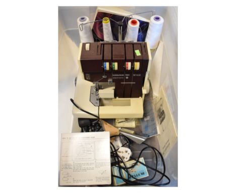 Hobbylock 794 electronic sewing machine with instruction manual, some accessories and yarns   Condition: 