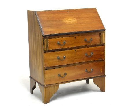 Early 20th Century inlaid mahogany bureau with chequer edge banding and urn patera over three long drawers on bracket feet, 7