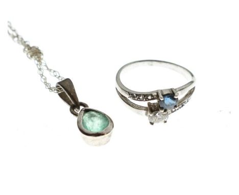 Dress ring set sapphire and white stone, together with an emerald coloured stone teardrop shaped pendant on fine chain   Cond