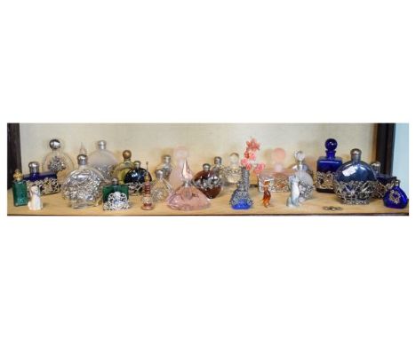 Collection of mainly late 20th Century white metal mounted perfume bottles (one shelf)   Condition: 