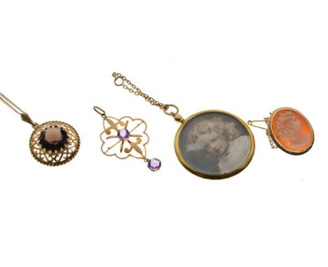 Oval portrait cameo, the mount stamped 'K18', 9ct gold double-sided portrait frame, two other pendants and a fine chain, 20.2