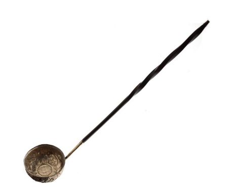 George III toddy ladle having an embossed unmarked white metal bowl inset with a coin, typical twist handle   Condition: 