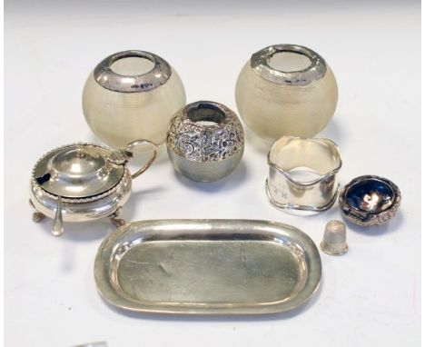 Three glass match strikers, each having silver mounts, a George V oval silver pin dish, Birmingham 1923, a George V silver mu