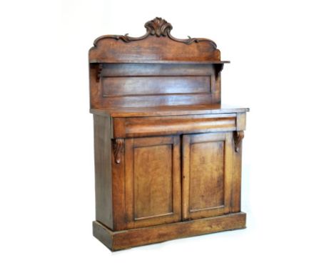 Victorian mahogany chiffonier having carved cresting above one shelf, the base fitted one frieze drawer over two blind panel 