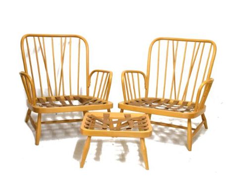 Pair of Ercol fireside chair frames, together with a matching footstool frame (3)   Condition: 