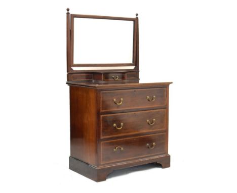 Edwardian inlaid mahogany dressing chest, the raised back with swing mirror and a single trinket drawer, the base fitted thre
