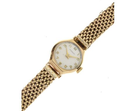 Lady's 9ct gold cased Tissot cocktail watch having conforming bracelet, the champagne dial with Arabic numerals, 28.7g gross 