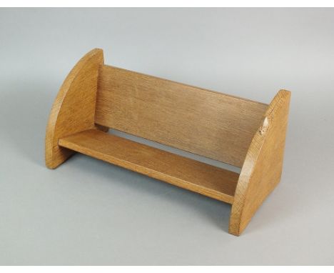 Robert ''Mouseman'' Thompson (British 1876-1955) An oak table top book rack carved with a mouse to the right hand side, 45.5c