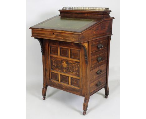 A Victorian simulated rosewood and inlaid Davenport, late 19th century, with gilt brass gallery top, lift top enclosing divis