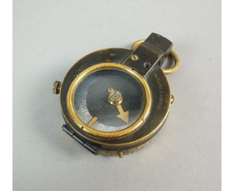 A WW1 Verners patent military compass, the back marked 'Cruchon & Emons London', number 40161 1915 and war department arrow