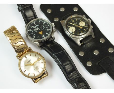 A Gentleman's 9ct gold Excalibur wristwatch, the silver dial with batons and date aperture, manual wind, with attached Excali