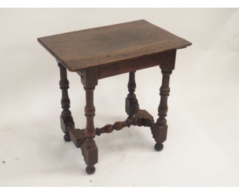 AN 18TH CENTURY AND LATER OAK JOINT STOOL the broad seat on ring turned baluster legs, joined by an H stretcher ,52cm high, 5