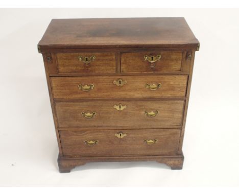 A GEORGE III MAHOGANY BACHELORS CHEST the hinged fold-over top above two short and three long drawers and on bracket feet, 79