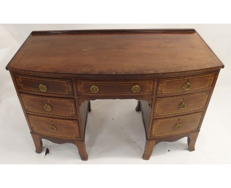 A 19TH CENTURY MAHOGANY AND INLAID BOWFRONT DRESSING TABLE with rail back above a central drawer and flanked by two sets of t