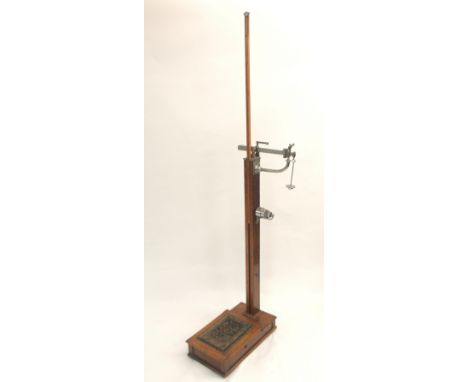 A W &amp; T AVERY OAK FLOOR SCALES, with assorted weights, the main shaft with adjustable height rule, 136cm high Condition R