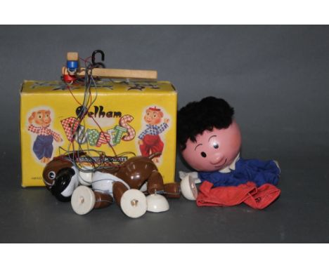 A boxed "Bengo the boxer dog" composition puppet together with another composition hand puppet.