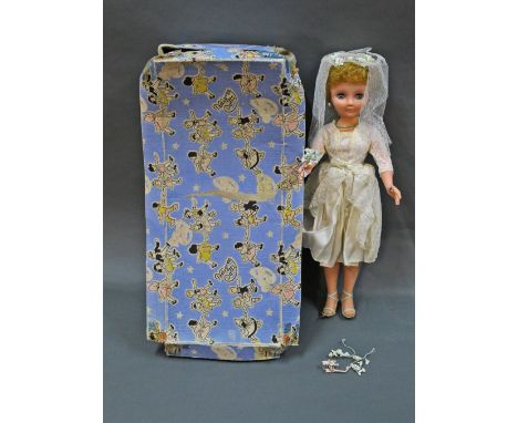 A 1960's boxed Pedigree Teenage Bride doll, measuring 51 cm (20 ins) tall, with original Pedigree bridal outfit, flower bouqu