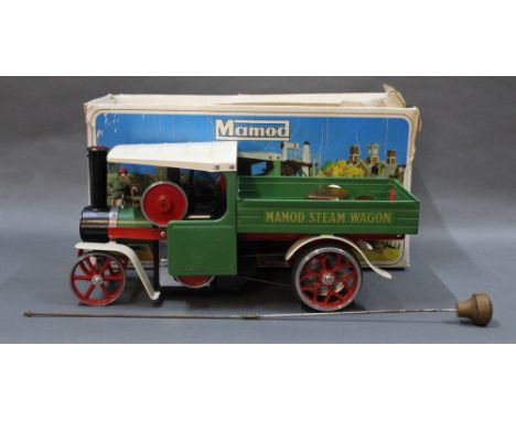 A 1970's Mamod SW1 steam wagon, in green and red, with spirit lamp filler funnel and detachable steering extension  