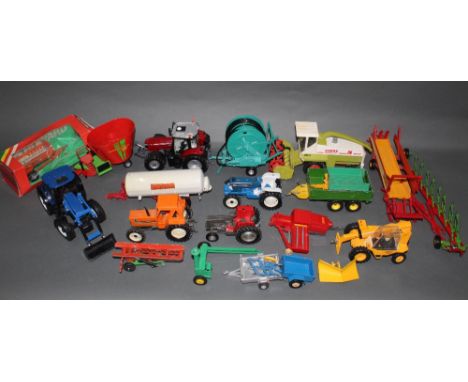 A group lot of Britain's diecast agricultural model vehicles, comprising combine harvester and various tractors    