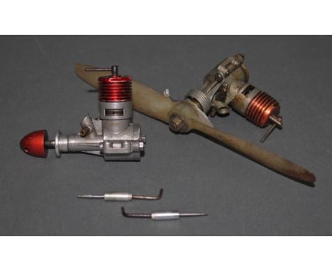 A DC Sabre 1.5cc diesel engine plus another with propeller 