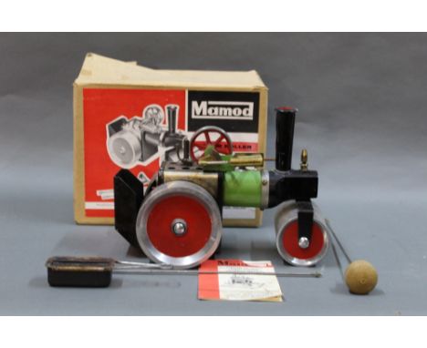 A boxed 1960's Mamod SR1 steam roller with burner and steering rod.