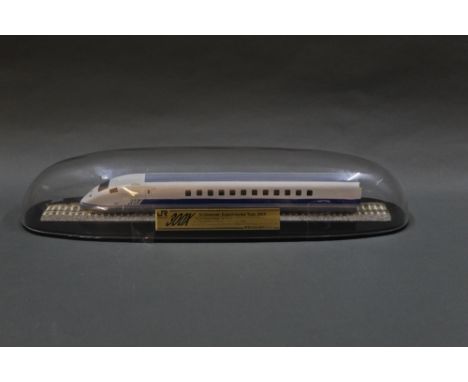 A scale model of a Japanese Shinkansen experimental train, displayed within a plastic domed case, length 40 cm.