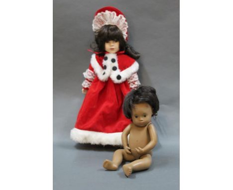 Two 1970's vinyl Sasha baby dolls and a more contemporary porcelain doll in red outfit   