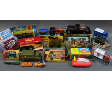 A group lot of diecast and plastic model vehicles and toys, including a Lone Star Farm King tractor and trailer, a Mak's Roya