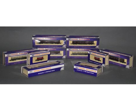 Ten Dapol N gauge model coaches and wagons.