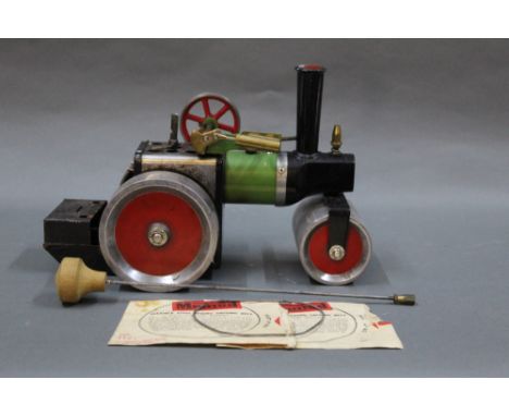 A 1970's Mamod SR1 A live steam roller, comprising engine, steering rod, burner tray and driving belts 