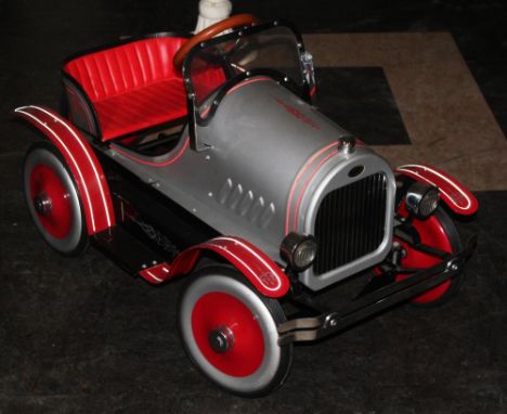 A Syot imitation delux Model T Ford Roadster pedal car in red and silver, measuring 94 cm long  