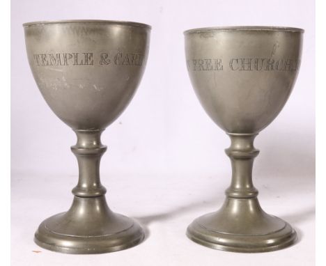 Pair of pewter chalice cups inscribed "Temple &amp; Carington Free Church, 1843", having knopped stem, raised on socle bases,