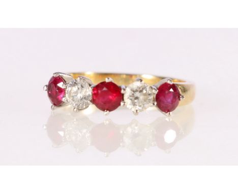 18ct yellow and white gold ruby and diamond set five stone half-hoop eternity ring, the round diamonds each approx 0.3ct, siz