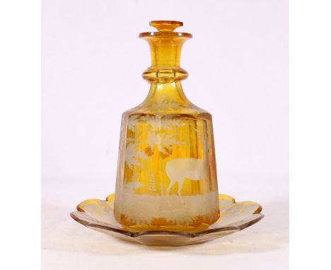 Bohemian etched glass decanter decorated with stags in a landscape on a yellow ground, 22cm tall, also a similair lobed dish 